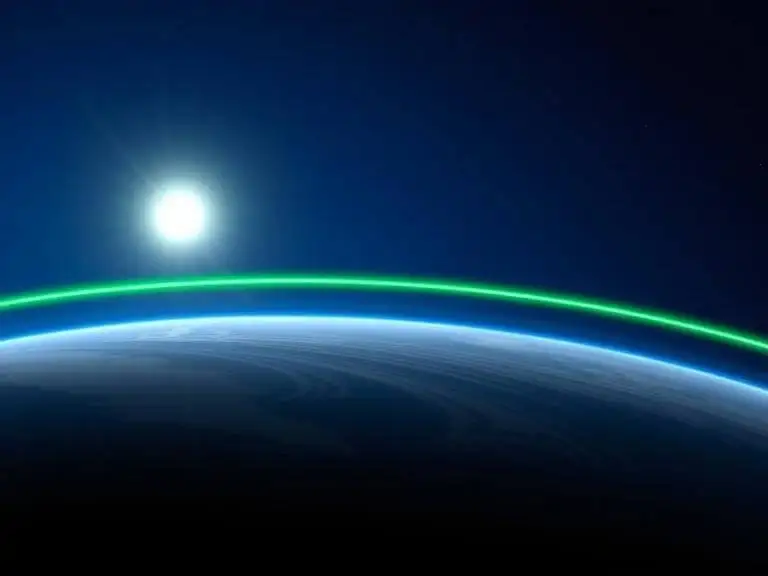 Image of the stratosphere’s ozone layer absorbing UV radiation, with a jet stream influencing weather, highlighting stratosphere ozone layer weather effects.