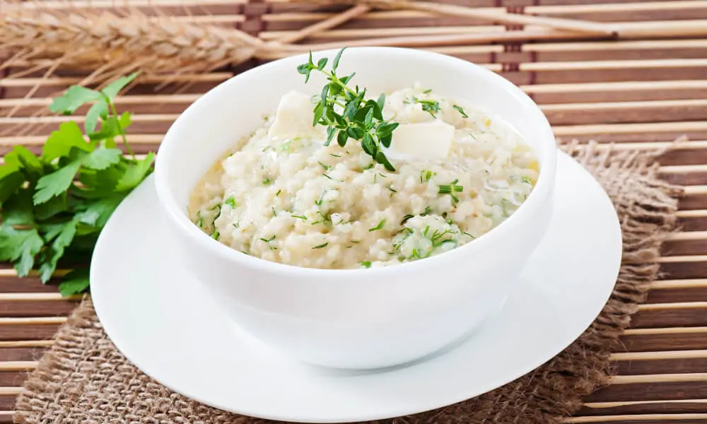 Moong dal khichdi with yogurt showing low-glycemic traditional Indian comfort food for diabetes blood sugar control.